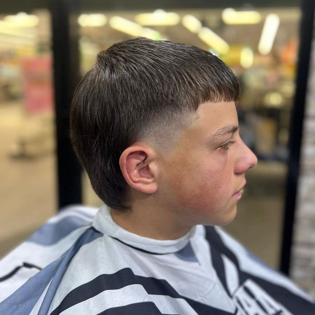 Textured crop with a taper fade, viewed in profile