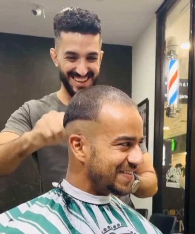 Ali and a client sharing a laugh at the end of a cut